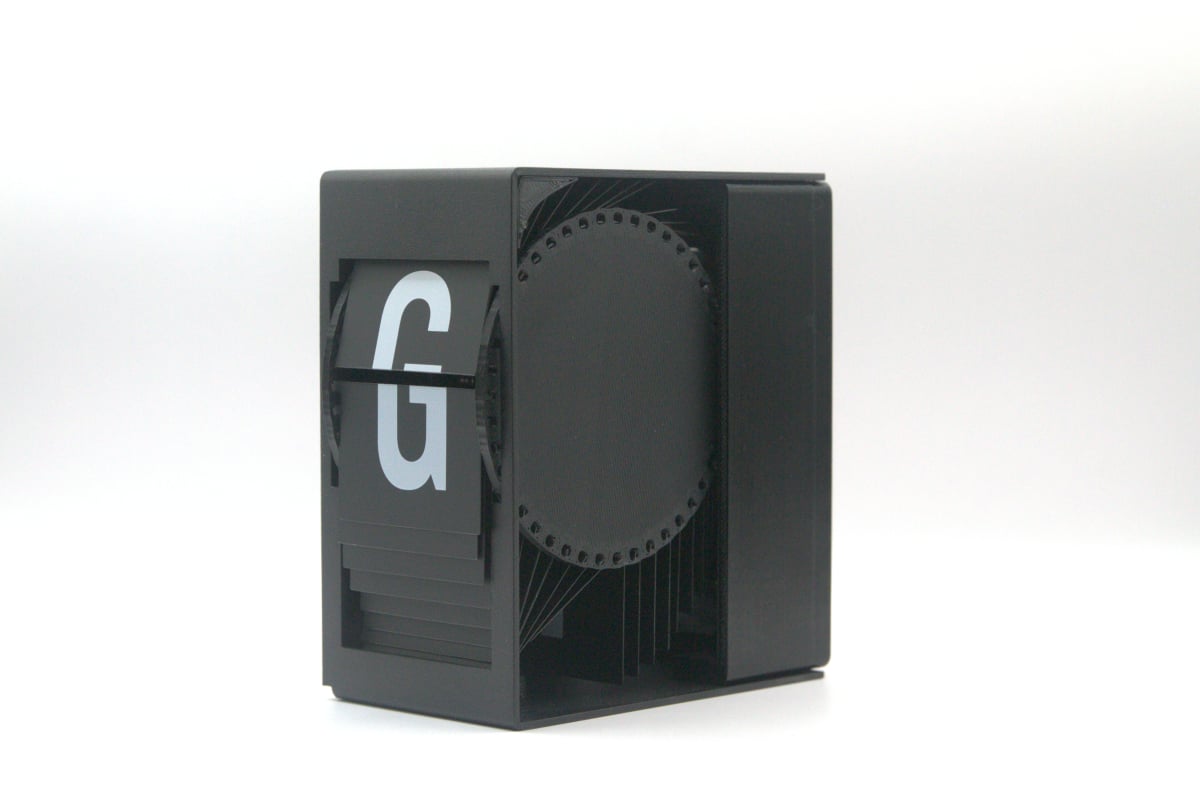 A finished flip forward module in black sheet metal.