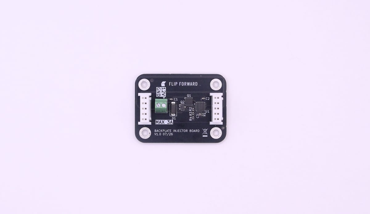 The flip forward backplate injector board, a black PCB with a green 12 V screw terminal, an eFuse and supporting components, marked MAX 3A.